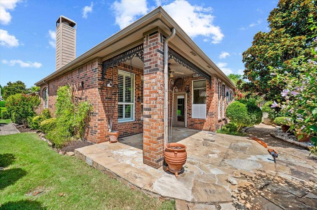 929 Oakland Hills Drive, Fairview, TX 75069 Rear extended flagstone covered patio with gardens all around