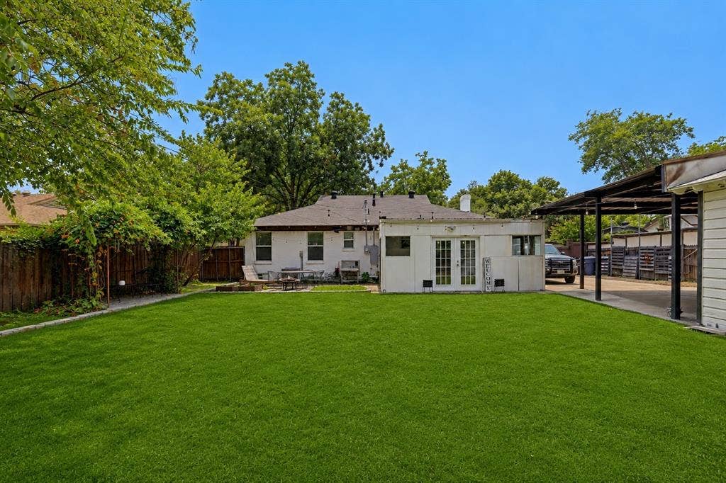 3111 Rotan Lane, Dallas, TX 75229 Spacious backyard with tons of green space. Grass has been digitally enhanced to be greener.