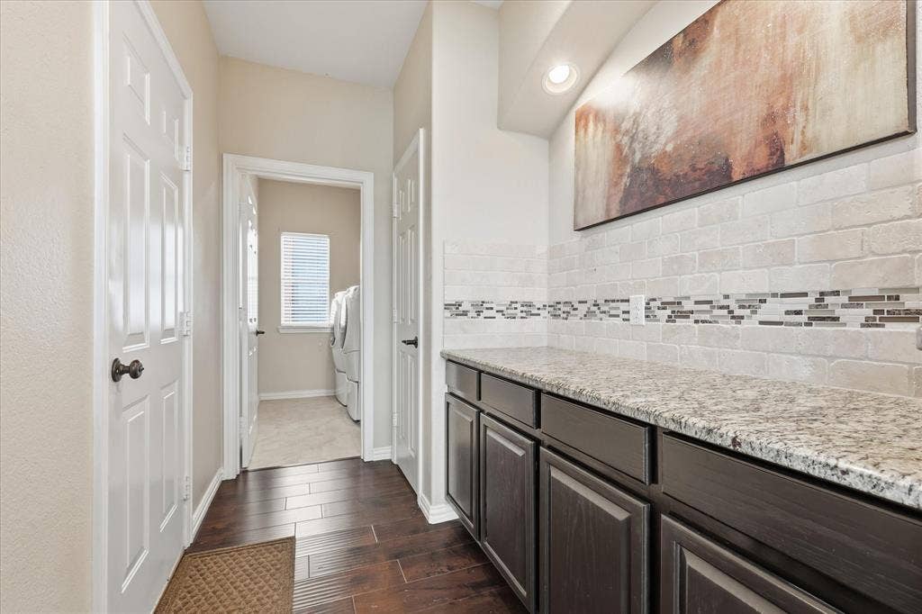 Mud room area leading to laundry