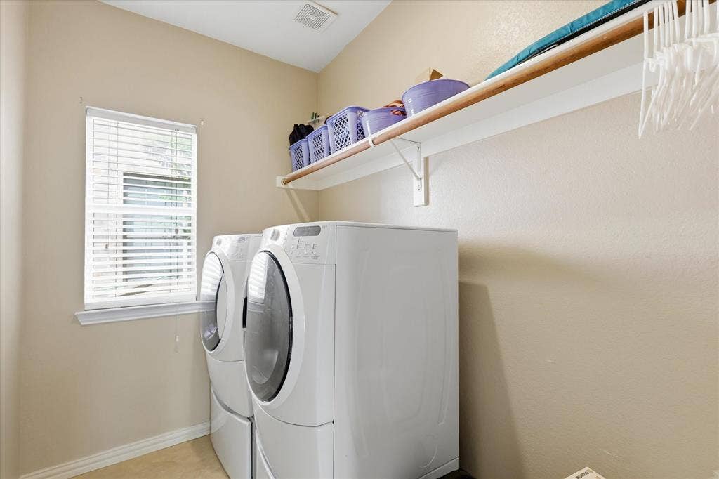 Laundry room has additional space for a fridge or freezer
