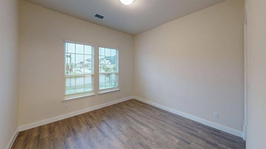 3314 Willena Road, Melissa, TX 75454 Two large windows with blinds, light-toned walls, wood-finish flooring, and a ceiling-mounted light fixture