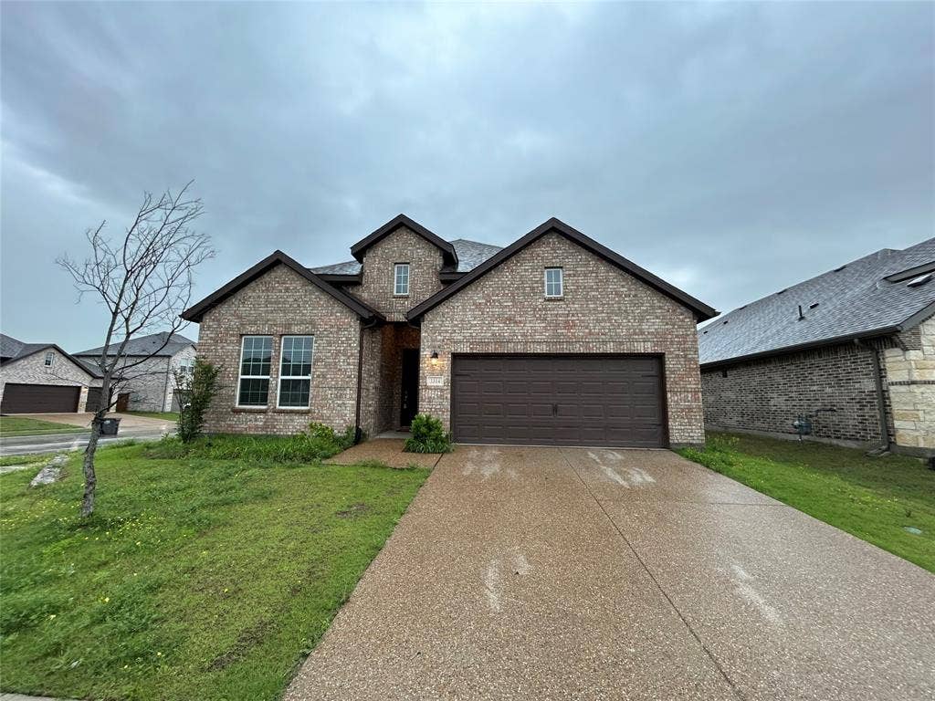 3314 Willena Road, Melissa, TX 75454 Brick exterior with dark trim and a single dormer