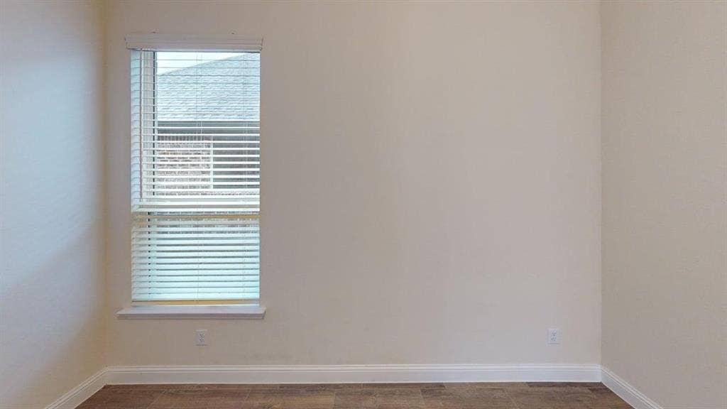 3314 Willena Road, Melissa, TX 75454 Neutral wall paint, wood-finish flooring, and a single window with blinds
