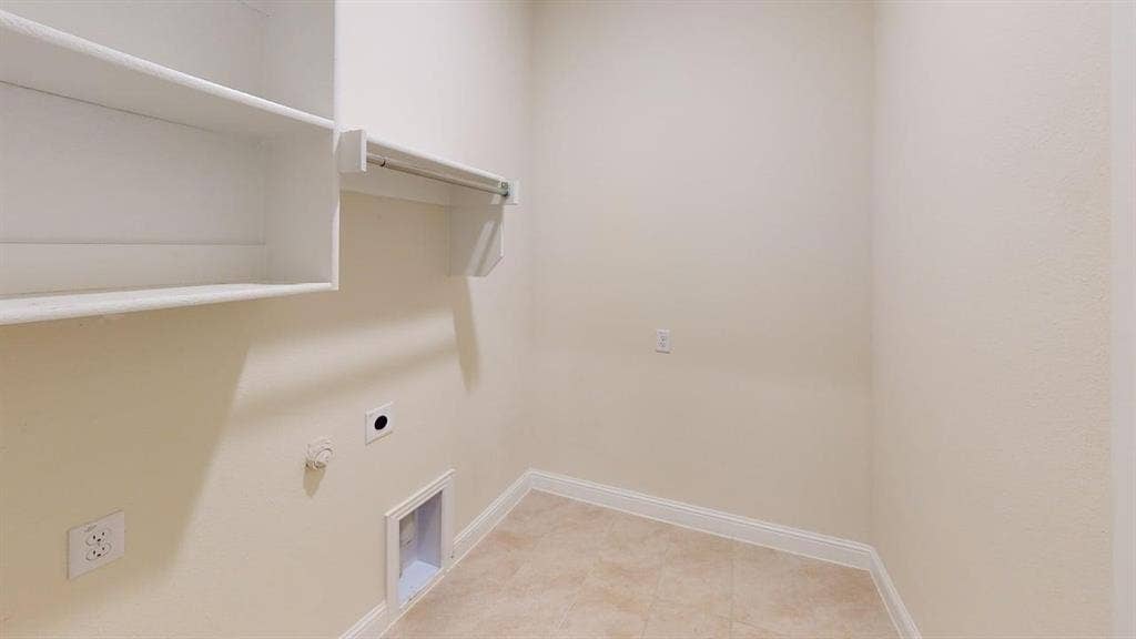 3314 Willena Road, Melissa, TX 75454 Built-in shelving, hanging rod, and tile flooring