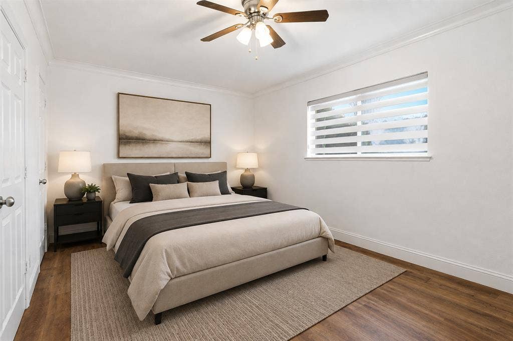 10207 Regal Oaks Drive, #109, Dallas, TX 75230 Virtually staged to demonstrate the scale and layout of the primary bedroom. Updated flooring and fresh paint create a clean, neutral backdrop.
