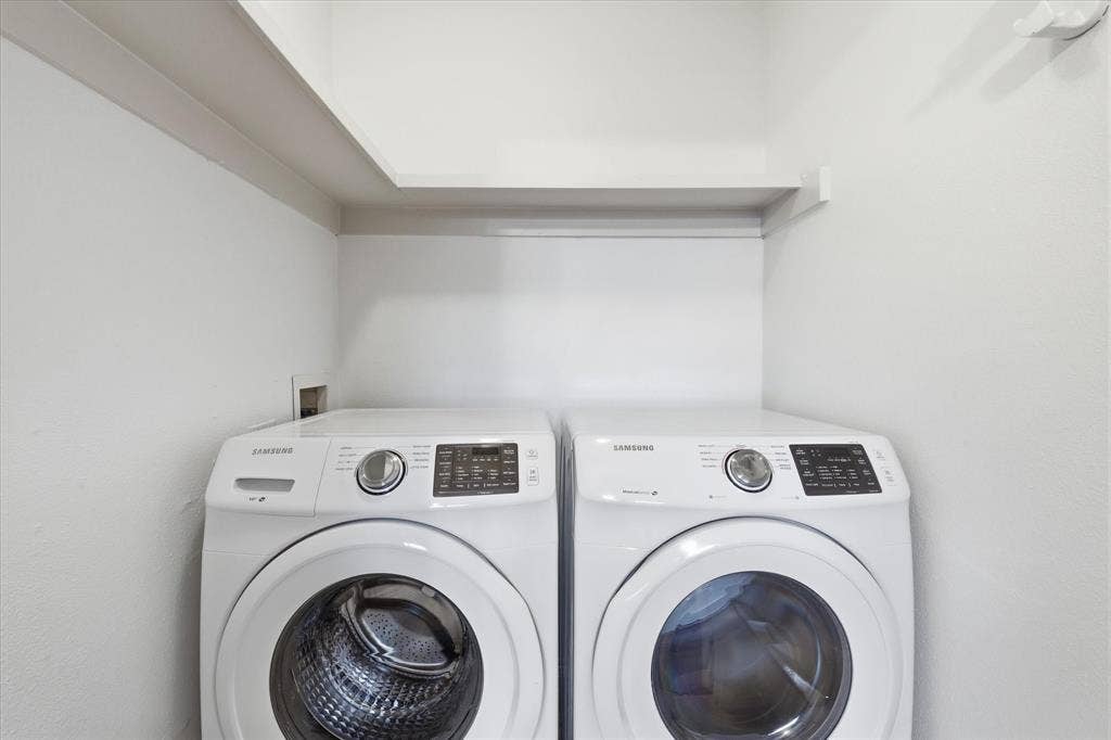 10207 Regal Oaks Drive, #109, Dallas, TX 75230 Dedicated in-unit utility space with full-size washer and dryer that convey with the condo sale. Tucked away discretely in the primary bedroom.