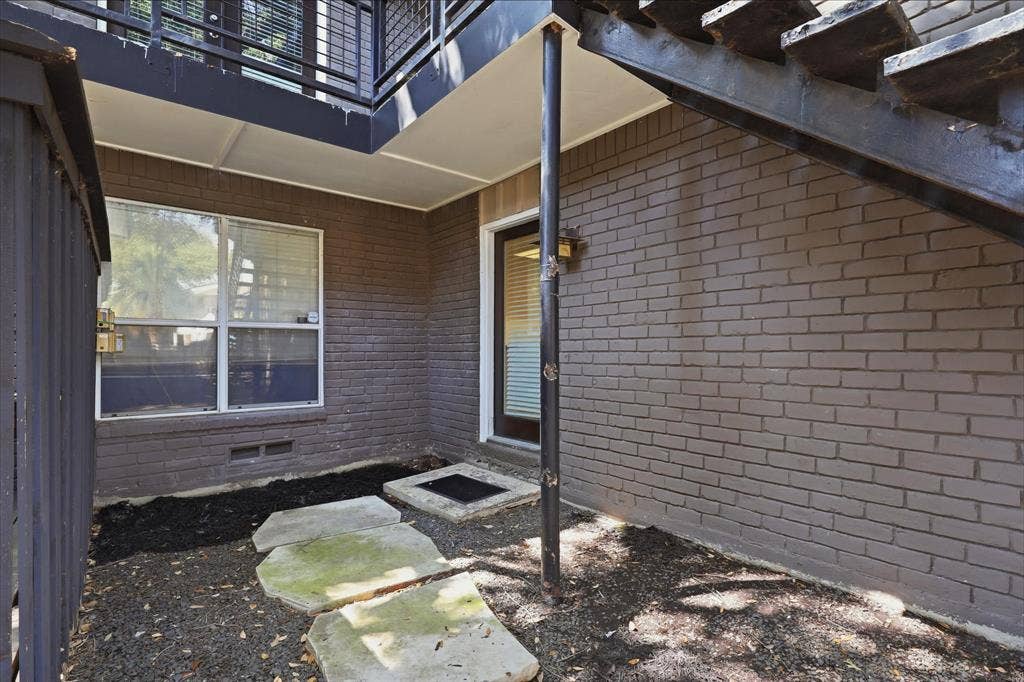 10207 Regal Oaks Drive, #109, Dallas, TX 75230 Rear entrance/exit to condo #109 goes straight into the kitchen.