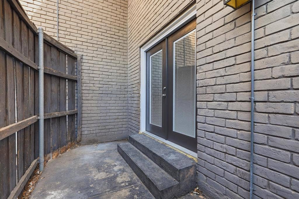 10207 Regal Oaks Drive, #109, Dallas, TX 75230 Private outdoor patio located just outside the secondary bedroom offers a low maintenance space for a few chairs or a gorgeous area for your potted plants, twinkle lights and turf.