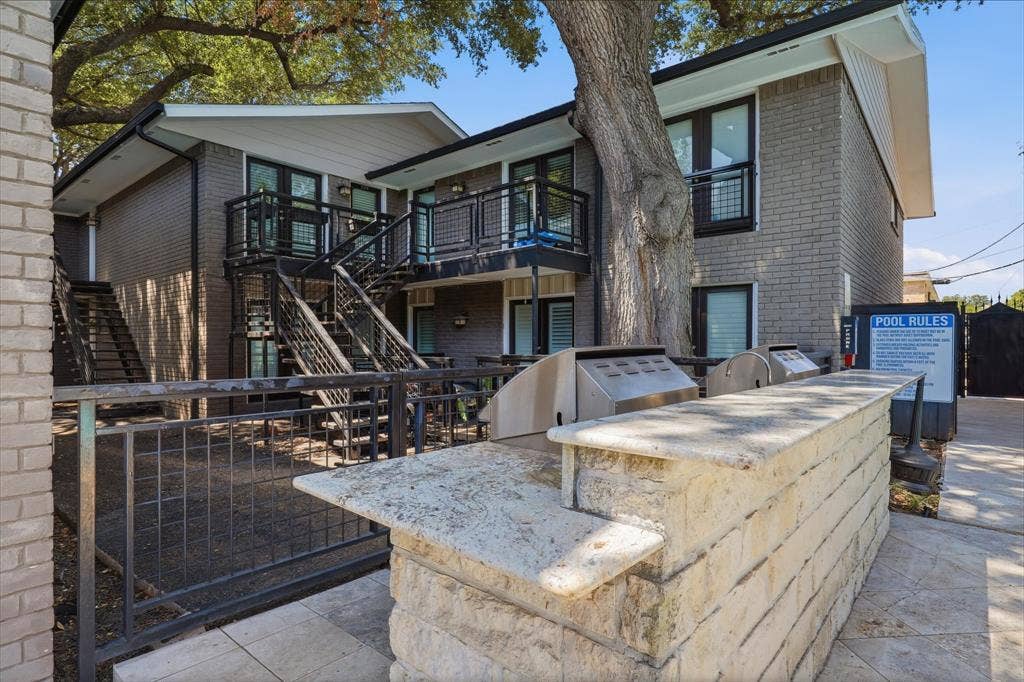 10207 Regal Oaks Drive, #109, Dallas, TX 75230 Residential outdoor grilling and gathering area conveniently located near the pool and moments from your condo.