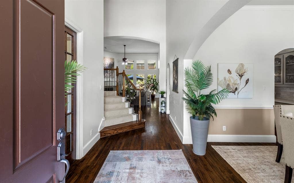 1708 Chessington Lane, McKinney, TX 75072 Beautiful entry with warm hardwoods, soaring ceilings and the perfect layout.