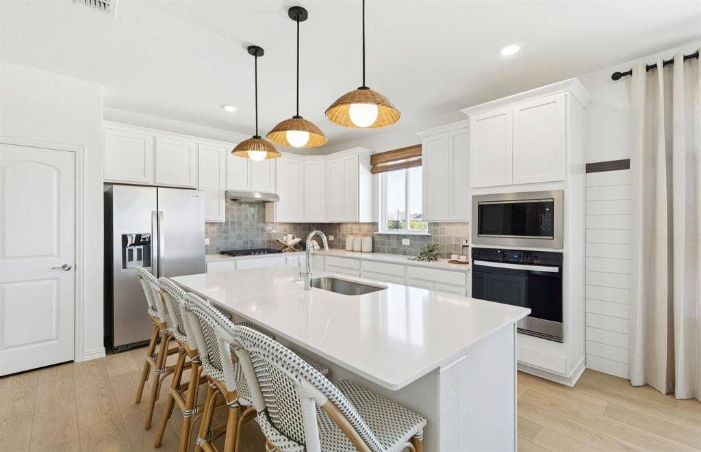 1604 Kendell Street, Anna, TX 75409 *Model Representation - Spacious kitchen with eat-in bartop island