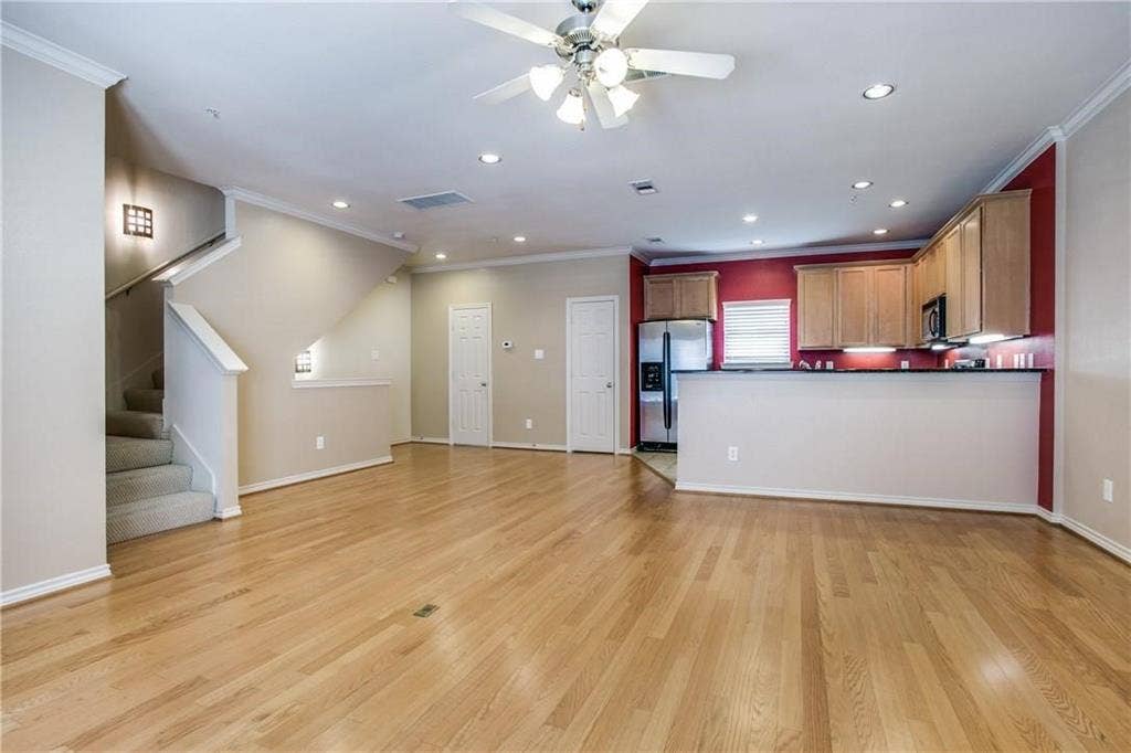 2415 Stutz Drive, #D, Dallas, TX 75235 Wood-finish flooring, recessed ceiling lights, and a ceiling fan with light fixture