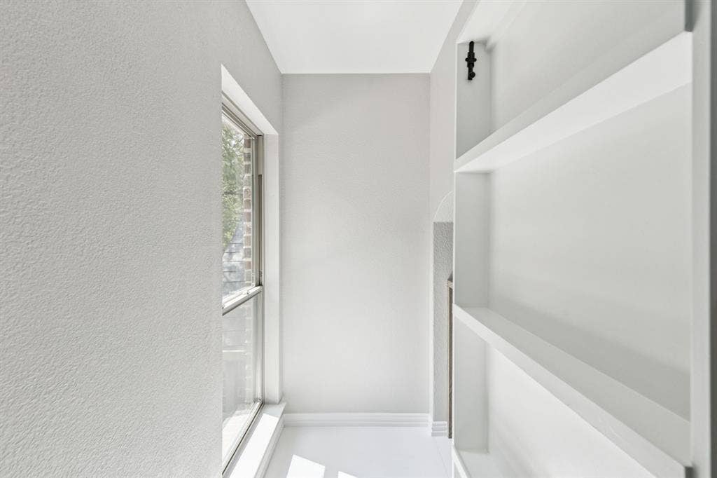 15456 Mountain View Lane, Frisco, TX 75035 Built-in shelving, white walls, large window, and white trim