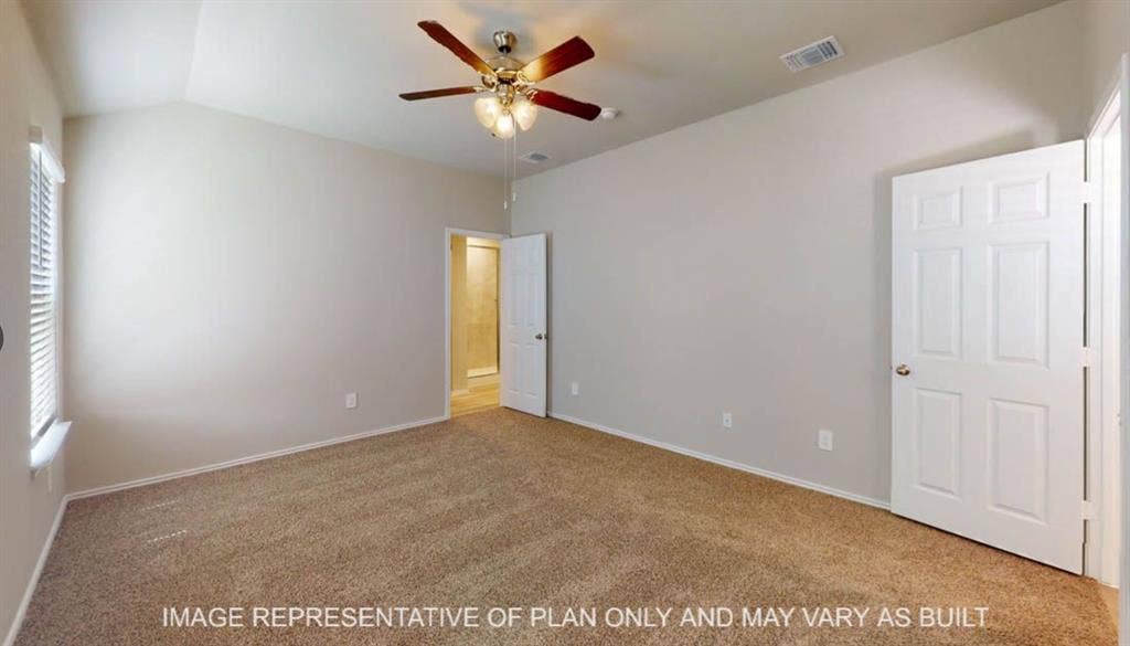 3112 Cyprian Road, Lorena, TX 76655 Spacious bedroom with neutral wall finishes, wood-finish flooring, ceiling fan with integrated lighting, and dual closet access via six-panel doors