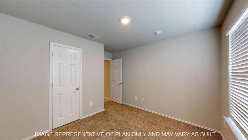 3112 Cyprian Road, Lorena, TX 76655 Spacious secondary bedroom with neutral wall finishes, recessed ceiling lighting, and abundant natural light from dual windows