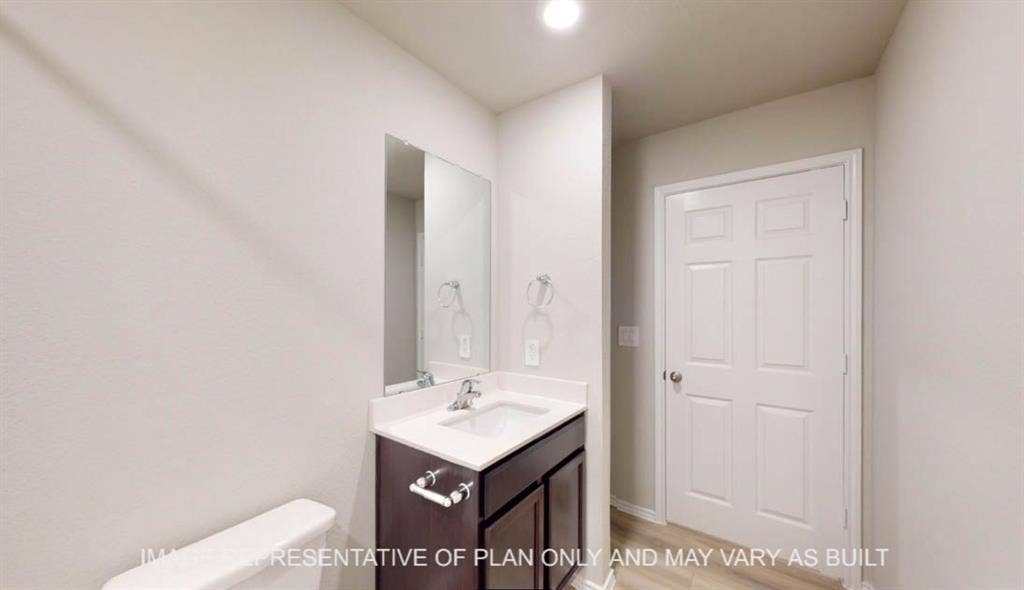 3112 Cyprian Road, Lorena, TX 76655 Vanity with a white countertop and integrated sink, chrome faucet, and rectangular mirror