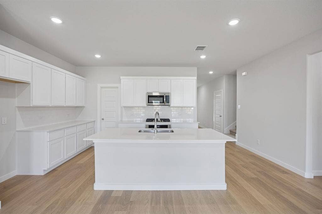1324 Companero Street, Haslet, TX 76052 Kitchen in the Masters home plan by Trophy Signature Homes – REPRESENTATIVE PHOTO