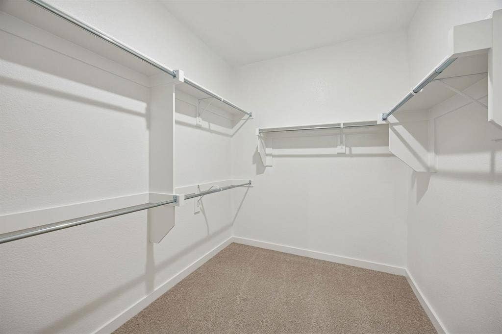1324 Companero Street, Haslet, TX 76052 Primary Closet in the Masters home plan by Trophy Signature Homes – REPRESENTATIVE PHOTO