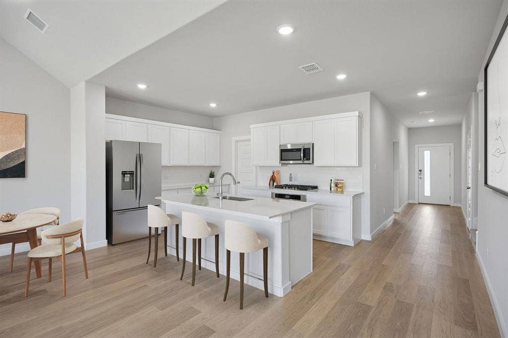 1324 Companero Street, Haslet, TX 76052 Kitchen in the Masters home plan by Trophy Signature Homes – REPRESENTATIVE PHOTO