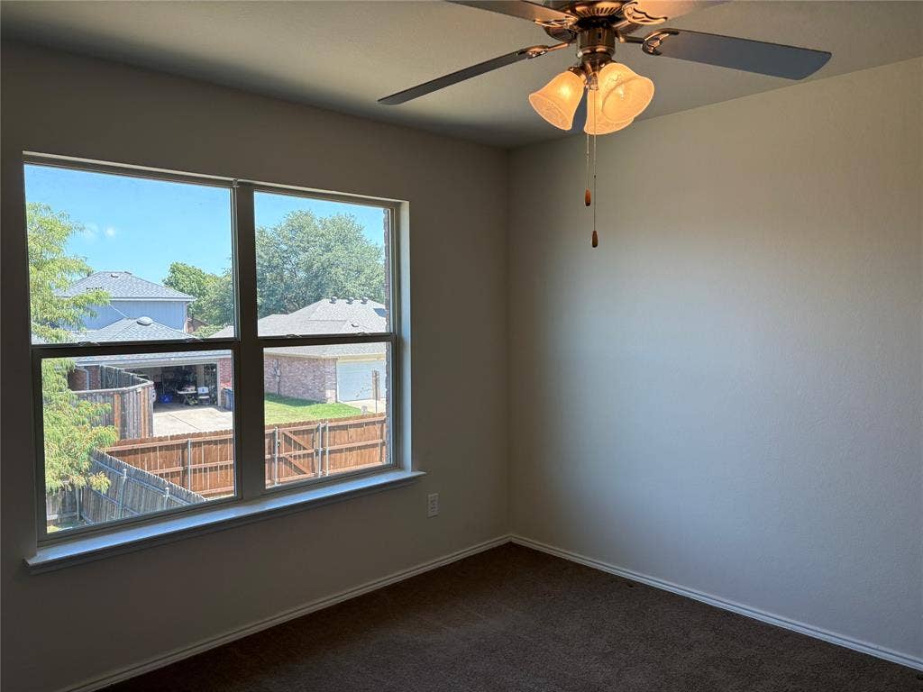 620 Fleming, Wylie, TX 75098 with ceiling fan and view of the outside