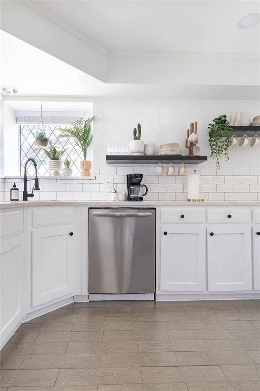 3612 Tumbril Lane, Plano, TX 75023 White shaker-style cabinetry with black knob hardware, stainless steel dishwasher, white subway tile backsplash, white countertops, and wood-finish flooring