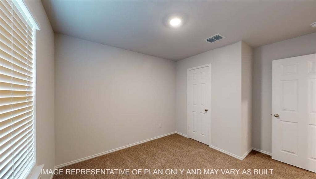 10428 Neptune Court, Waco, TX 76708 Carpeted flooring, white interior doors, window with blinds, recessed ceiling lighting, and neutral wall tones