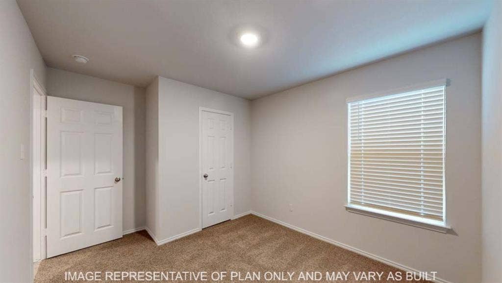 10428 Neptune Court, Waco, TX 76708 Carpeted flooring, recessed lighting, window with blinds, paneled interior doors, and neutral wall tones