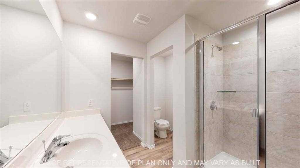 10428 Neptune Court, Waco, TX 76708 White vanity with integrated sink, chrome faucet, and expansive wall mirror