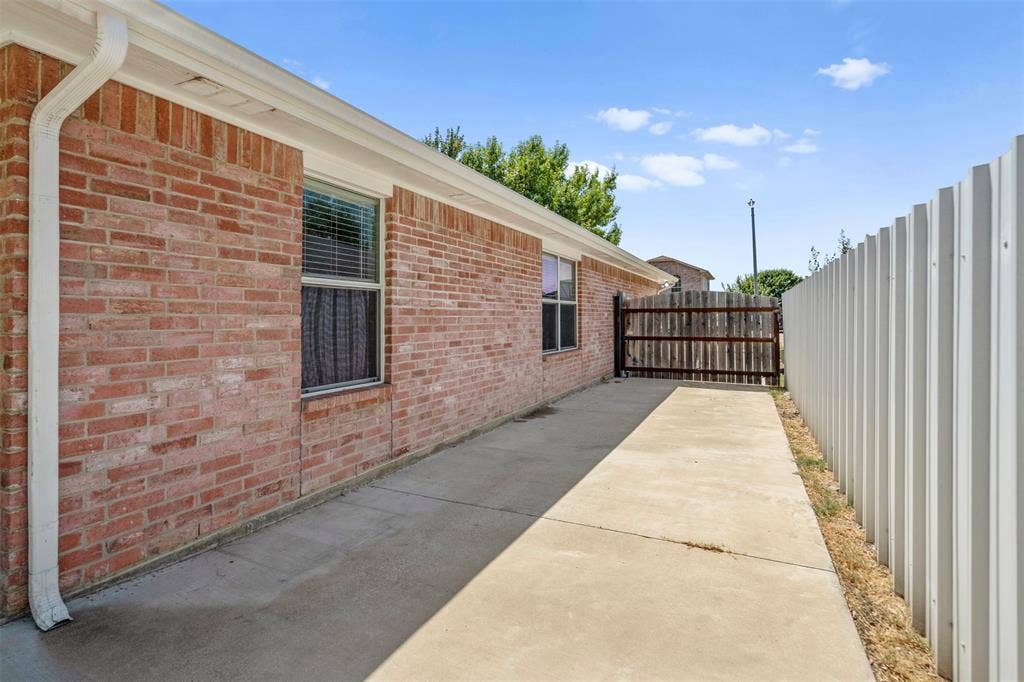 1626 Canary Island Court, Dallas, TX 75217 side with additional parking space