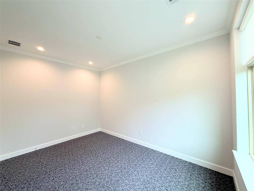 2120 Prairie Drive, 901 & #902, Prosper, TX 75078 Recessed lighting, crown molding, patterned carpet, and natural light from a prominent window