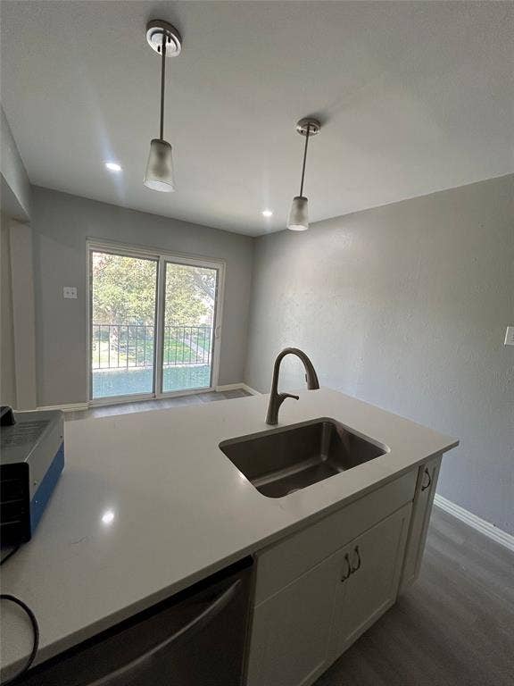 5826 Sandhurst Lane, #C, Dallas, TX 75206 Kitchen island with an undermount stainless steel sink and a high-arch faucet