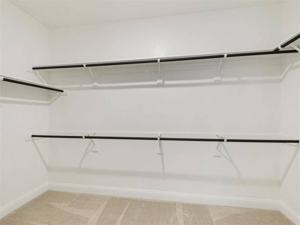 8305 Pine Island Way, McKinney, TX 75071 Built-in closet shelving and hanging rods
