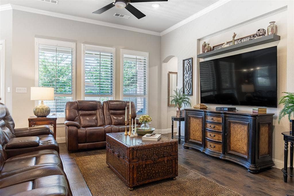 1101 10th Street, Argyle, TX 76226 Large family room with beautiful flooring and wood shutters. You need to see this room in person to understand how large it is!