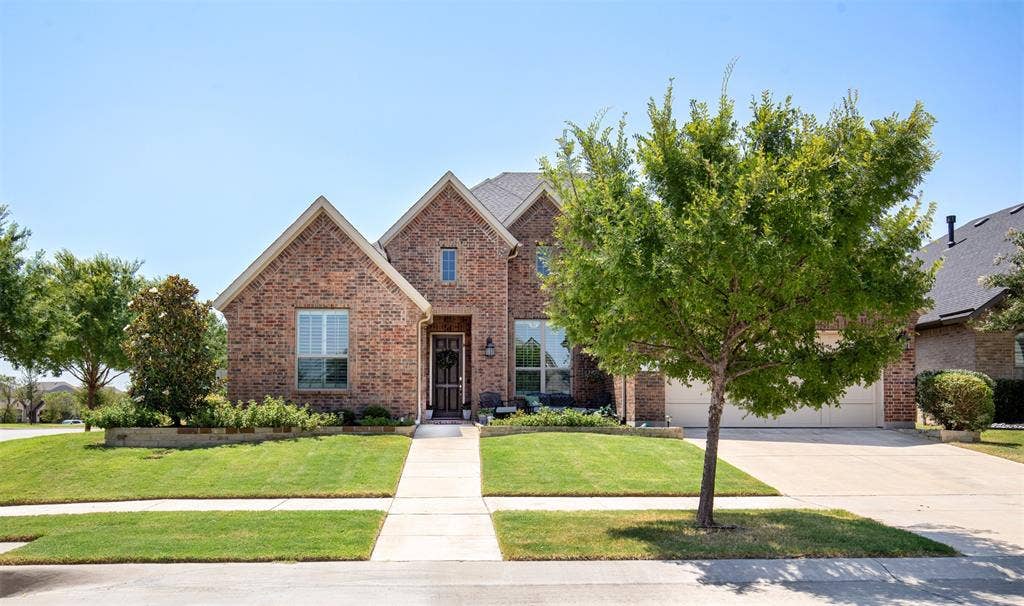 1101 10th Street, Argyle, TX 76226 Beautifully situated on a corner lot, this home welcomes you with lush, mature landscaping, a manicured lawn, and standout curb appeal.