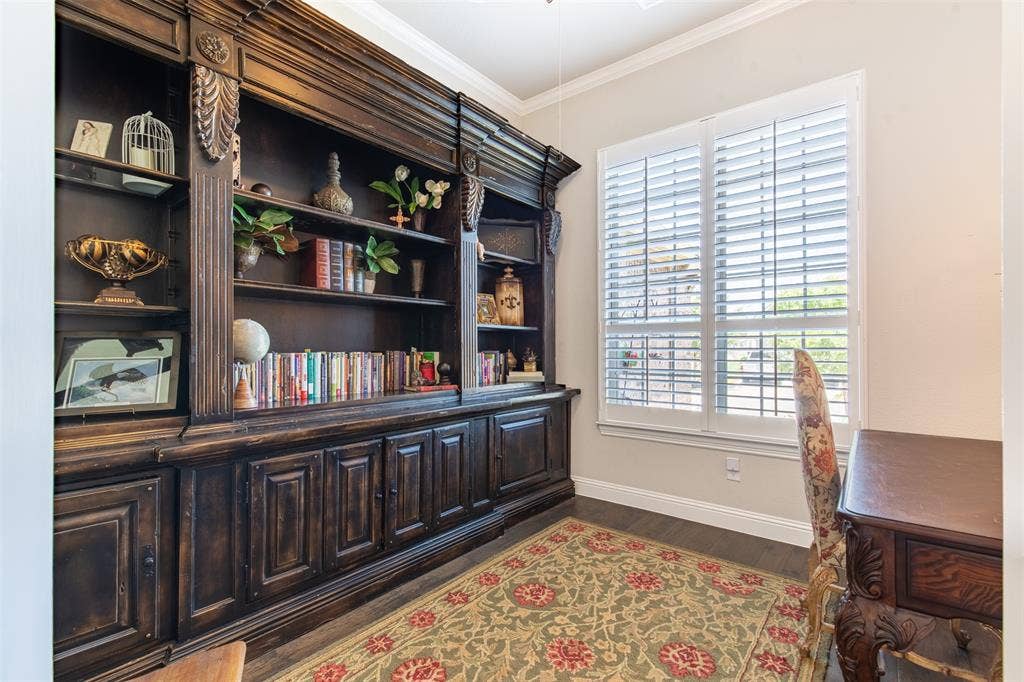 1101 10th Street, Argyle, TX 76226 This bright, airy study is quiet and peaceful. The shutters let in plenty of natural light, making the whole room feel welcoming.