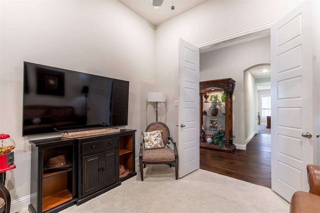 1101 10th Street, Argyle, TX 76226 The solid wood french doors adds privacy to this space. The second hallway leads to the second primary bedroom.