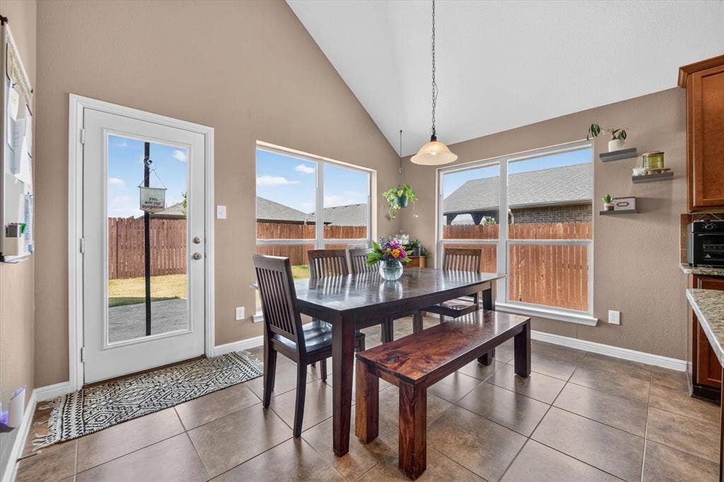 424 Foxcraft Drive, Fort Worth, TX 76131 Vaulted ceiling, tiled flooring, built-in shelving, white trim, and a glass-paneled exterior door
