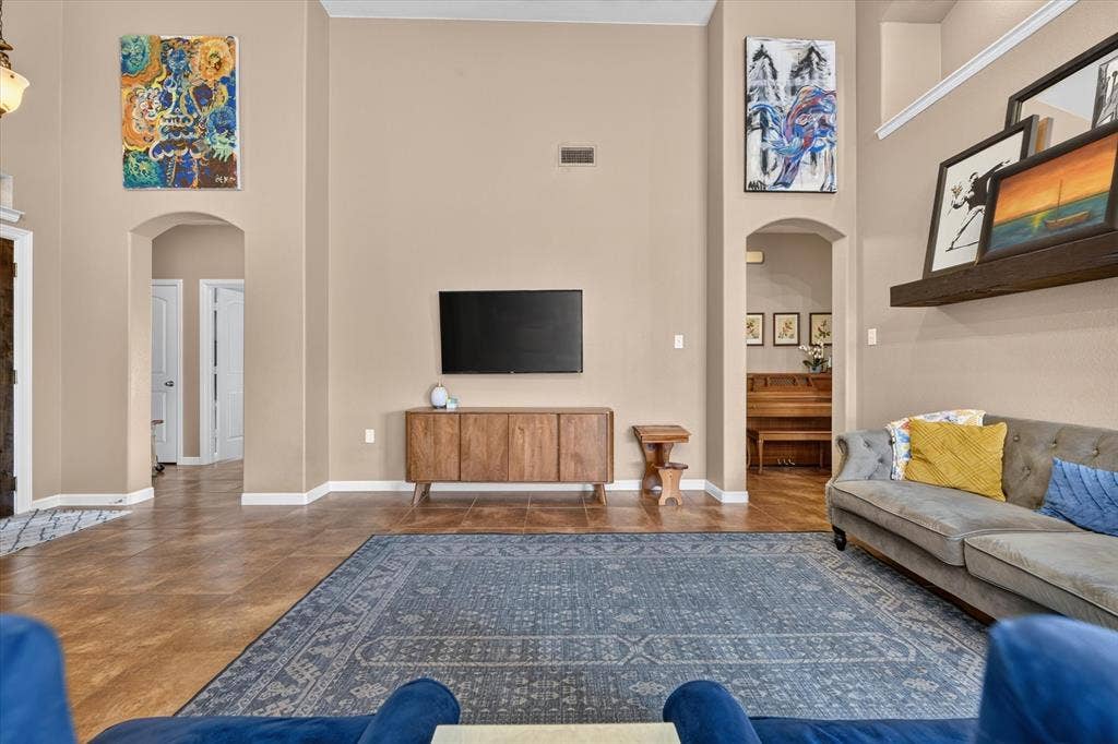 424 Foxcraft Drive, Fort Worth, TX 76131 Vaulted ceiling with archway entries and wood-finish flooring