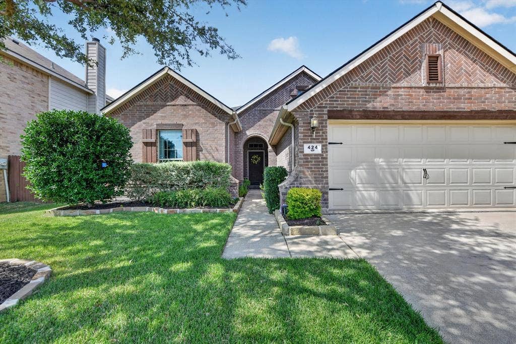 424 Foxcraft Drive, Fort Worth, TX 76131 Brick exterior with a gabled roof and decorative vent