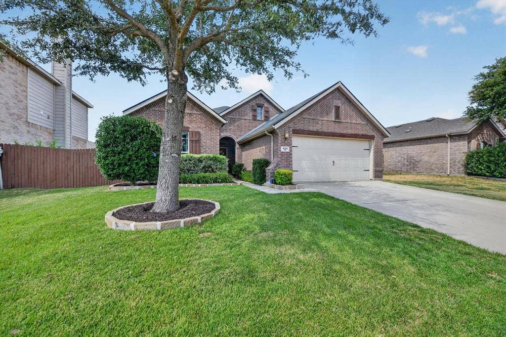 424 Foxcraft Drive, Fort Worth, TX 76131 Brick exterior with a gabled roof and attached garage