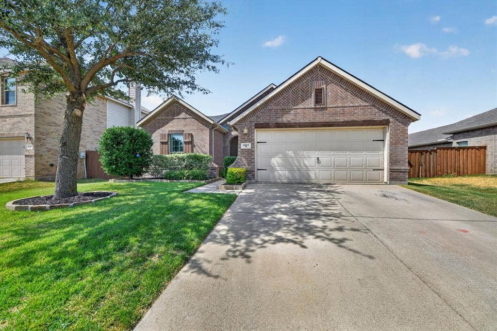 424 Foxcraft Drive, Fort Worth, TX 76131 Brick exterior with an attached garage and a concrete driveway