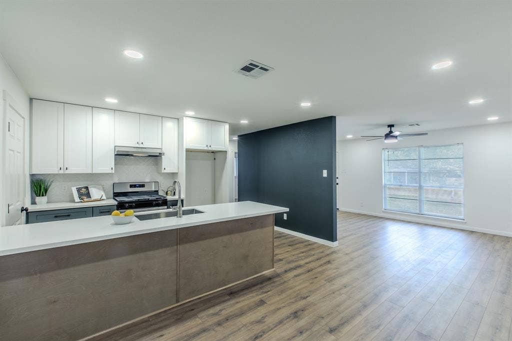 4133 Sherry Lane, Beverly Hills, TX 76711 Open-concept living space with wood-finish flooring