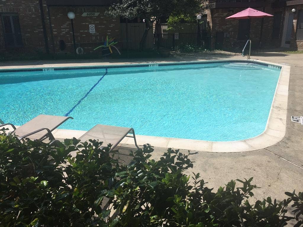 6050 Birchbrook Drive, #242, Dallas, TX 75206 Swimming pool with concrete surround and integrated steps