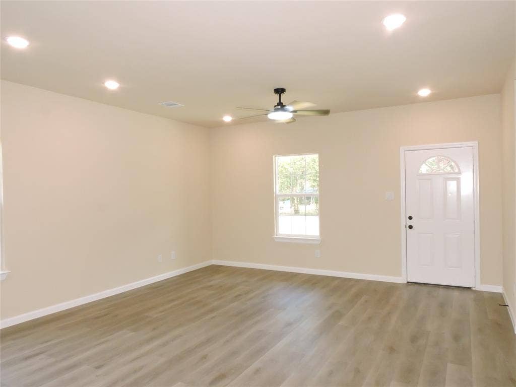 106 Navajo Drive, Mabank, TX 75156 Light wood-finish flooring with white trim, recessed ceiling lights, and a ceiling fan