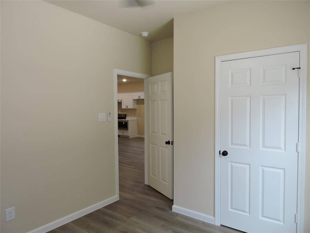 106 Navajo Drive, Mabank, TX 75156 Neutral wall tones, white trim, and wood-finish flooring