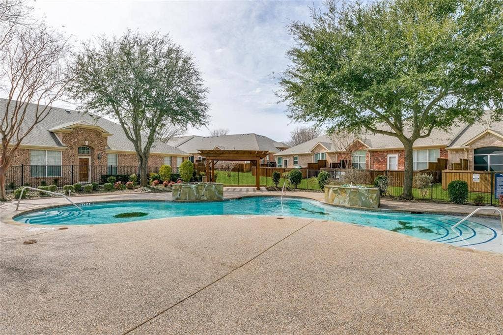 2829 Mott Street, Plano, TX 75025 Resort-style pool with integrated water features and textured decking