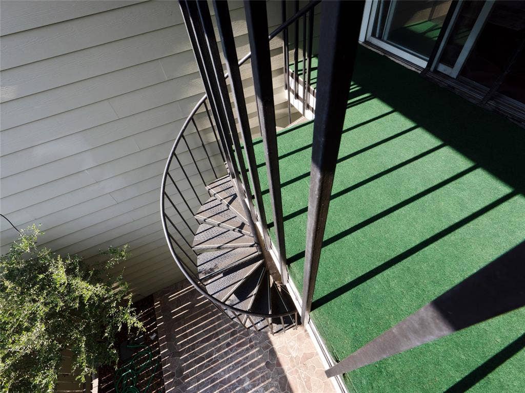 6220 Bentwood Trail, #205, Dallas, TX 75252 Black metal spiral staircase with perforated steps