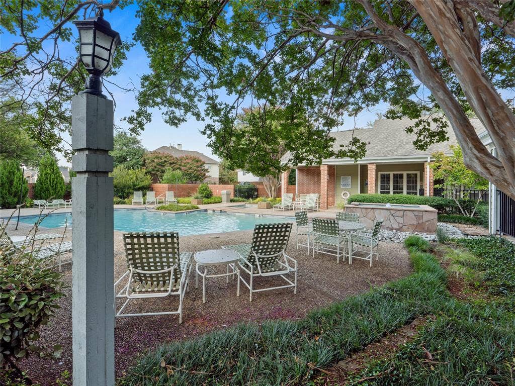 6220 Bentwood Trail, #205, Dallas, TX 75252 Swimming pool with adjacent spa, surrounded by a gravel patio and established landscaping
