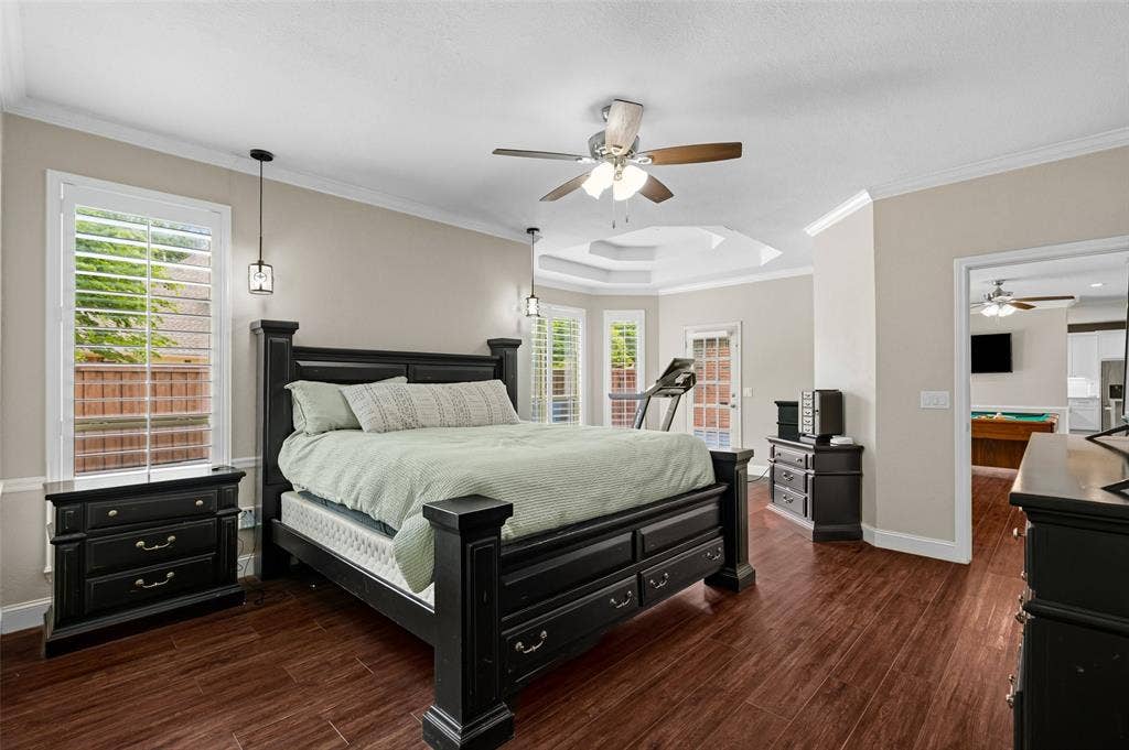 2705 Ithaca Court, Plano, TX 75025 Wood-finish flooring, ceiling fan, crown molding, and tray ceiling