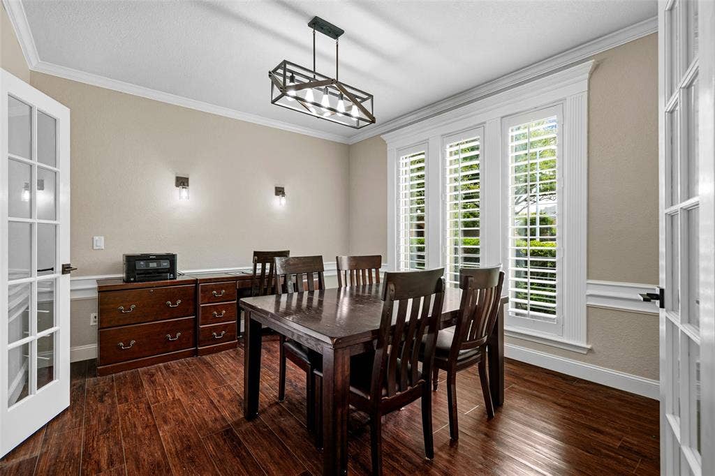 2705 Ithaca Court, Plano, TX 75025 Dark wood-finish flooring with white trim and crown molding
